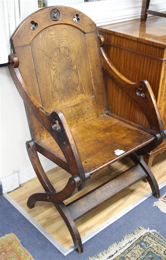 A 17th century style oak bishops chair, with relief carved lion rampant crest, W.70cm D.58cm approx. H.108cm